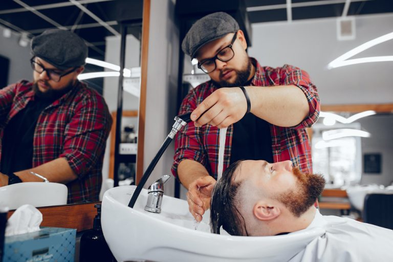 stylish-man-sitting-in-a-barbershop-Z8GS754.jpg